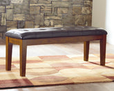 Coral Furniture - Ashley Furniture - Ralene Dining Bench - Large UPH Dining Room Bench / Medium Brown / 50"W x 16"D x 19"H - D594-00