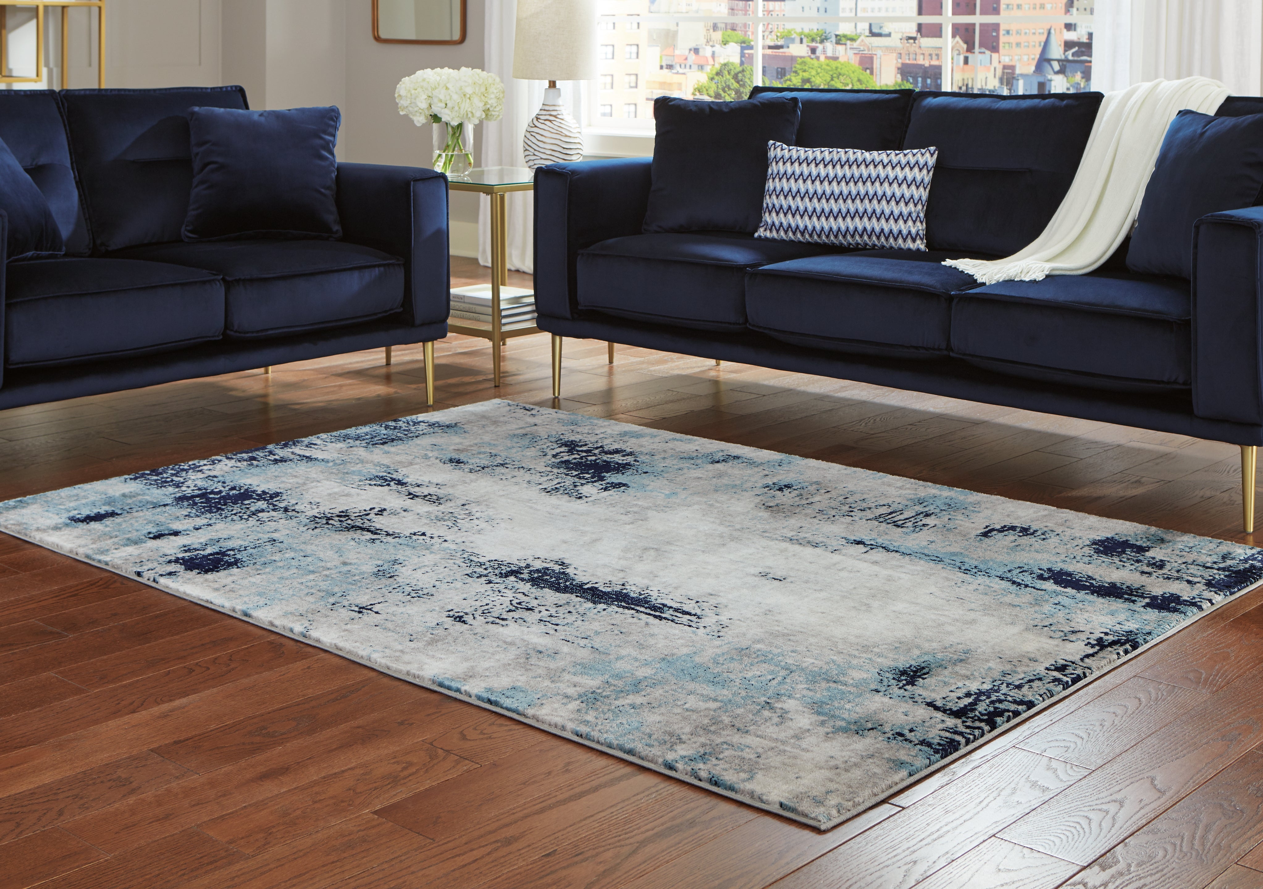 Coral Furniture - Ashley Furniture - Leonelle Rug - 7'10" x 10' Rug / White/Blue/Gray - R404871