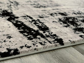 Coral Furniture - Ashley Furniture - Zekeman Rug - 7'10" x 10' Rug / Black/Cream/Gray - R404921