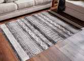 Coral Furniture - Ashley Furniture - Henchester Rug - 8' x 10' Washable Rug / Multi - R405991