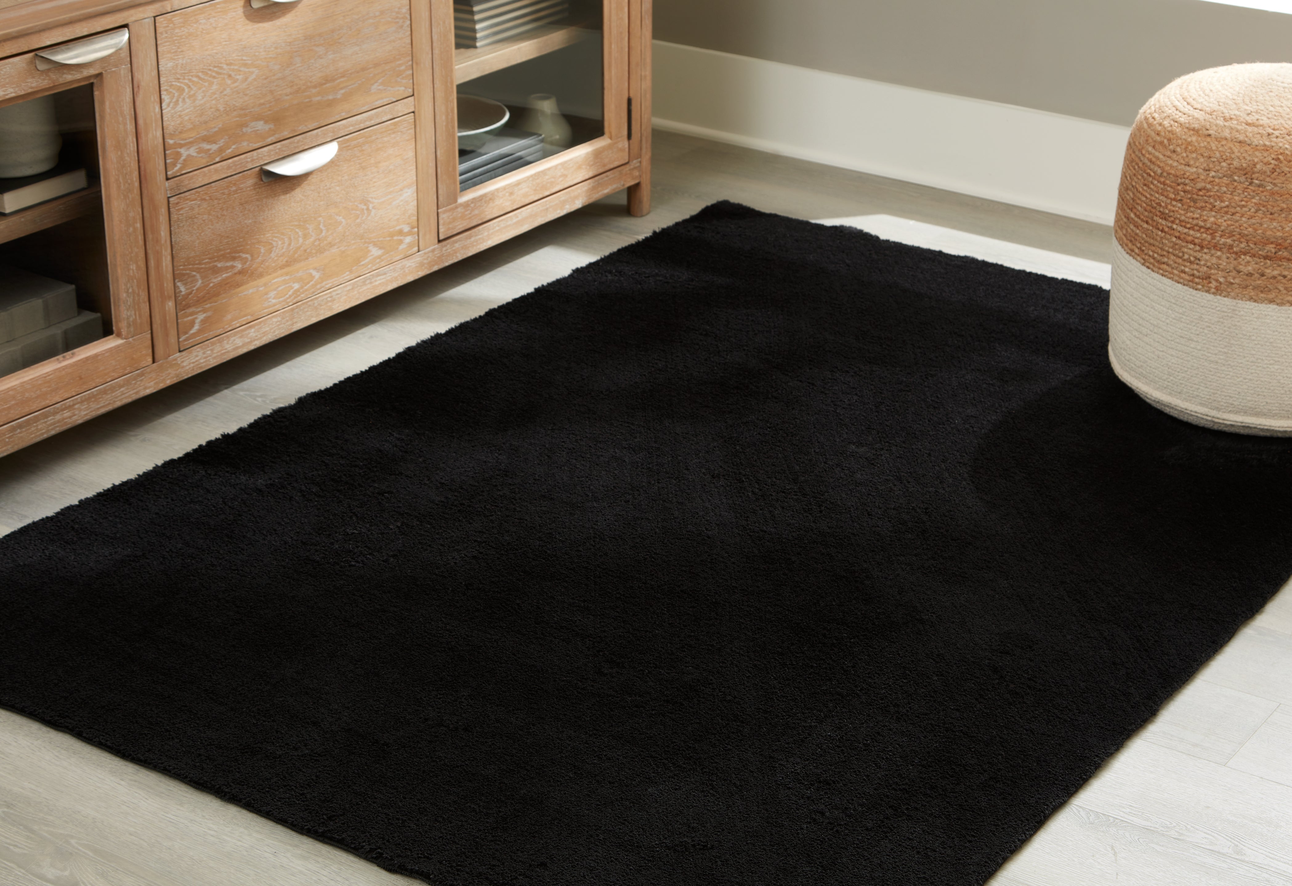 Coral Furniture - Ashley Furniture - Anaben Rug - 5' x 7' Washable Rug / Black - R406312