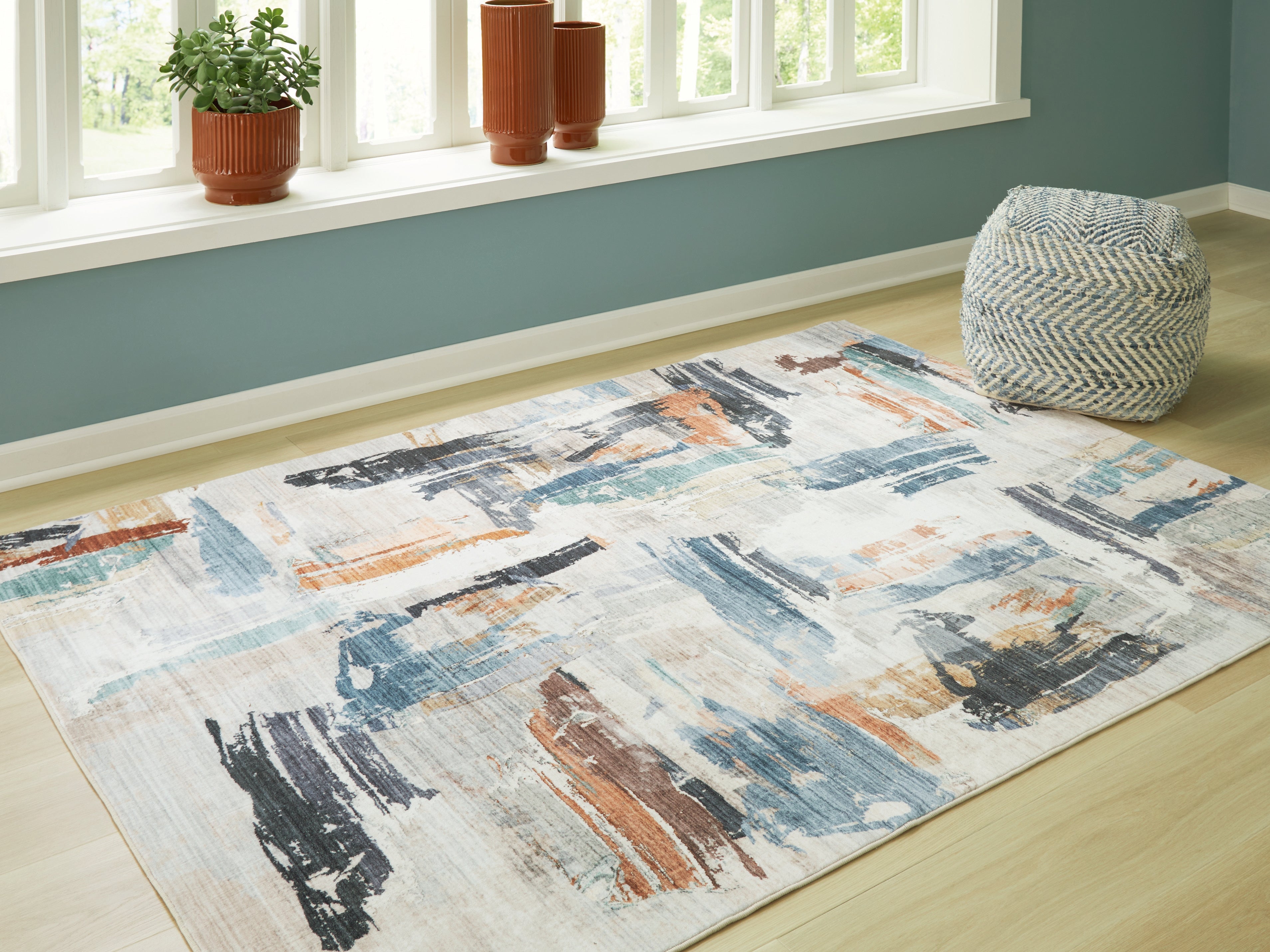 Coral Furniture - Ashley Furniture - Hessland Rug - 8' x 10' Washable Rug / Multi - R407051