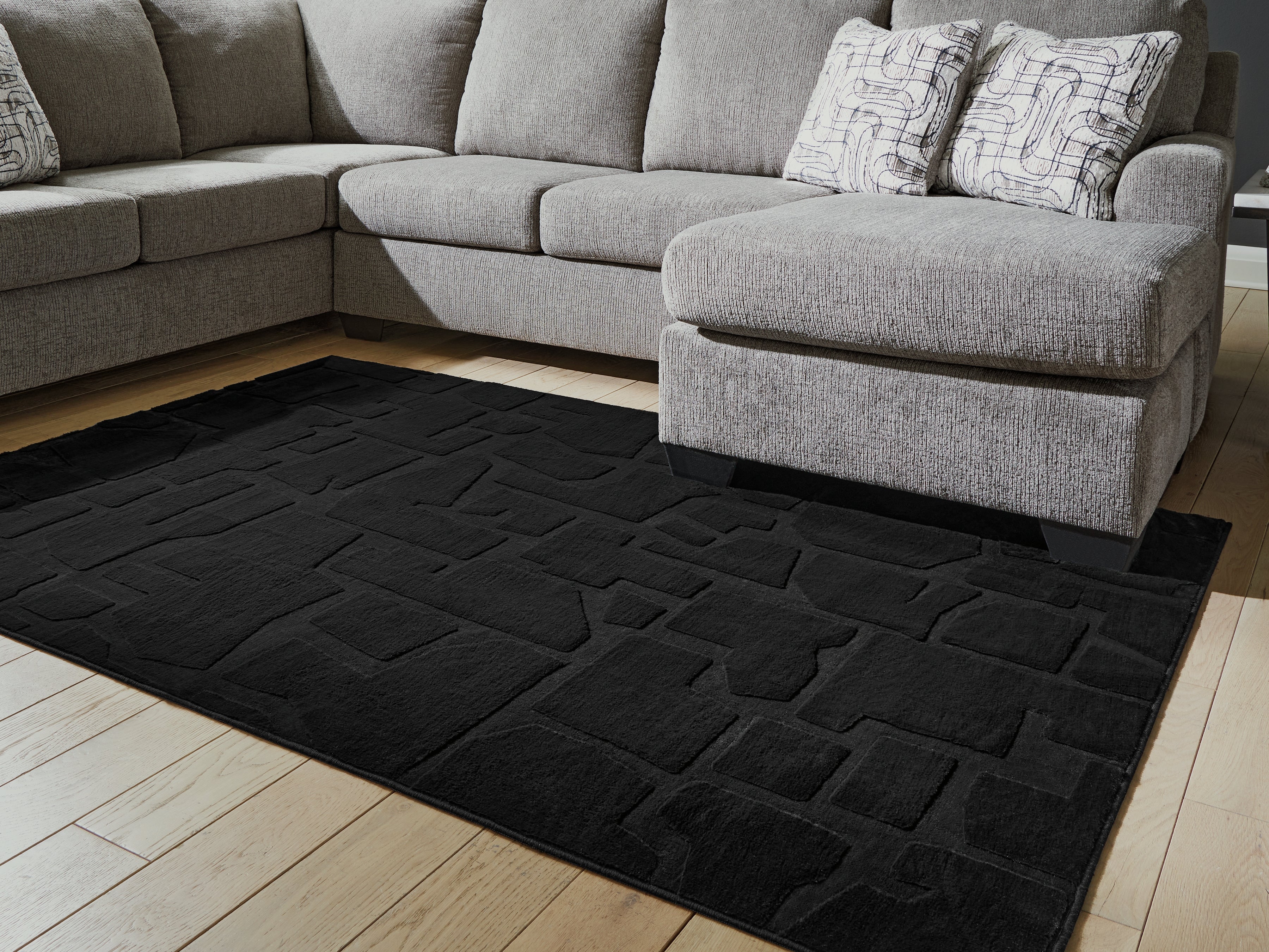Coral Furniture - Ashley Furniture - Gibbswell Rug - Washable 5' x 7' Area Rug / Black - R407462