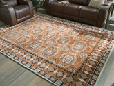 Coral Furniture - Ashley Furniture - Qaabiz Rug - 5' x 7' Area Rug / Sienna/Ivory/Black - R407522