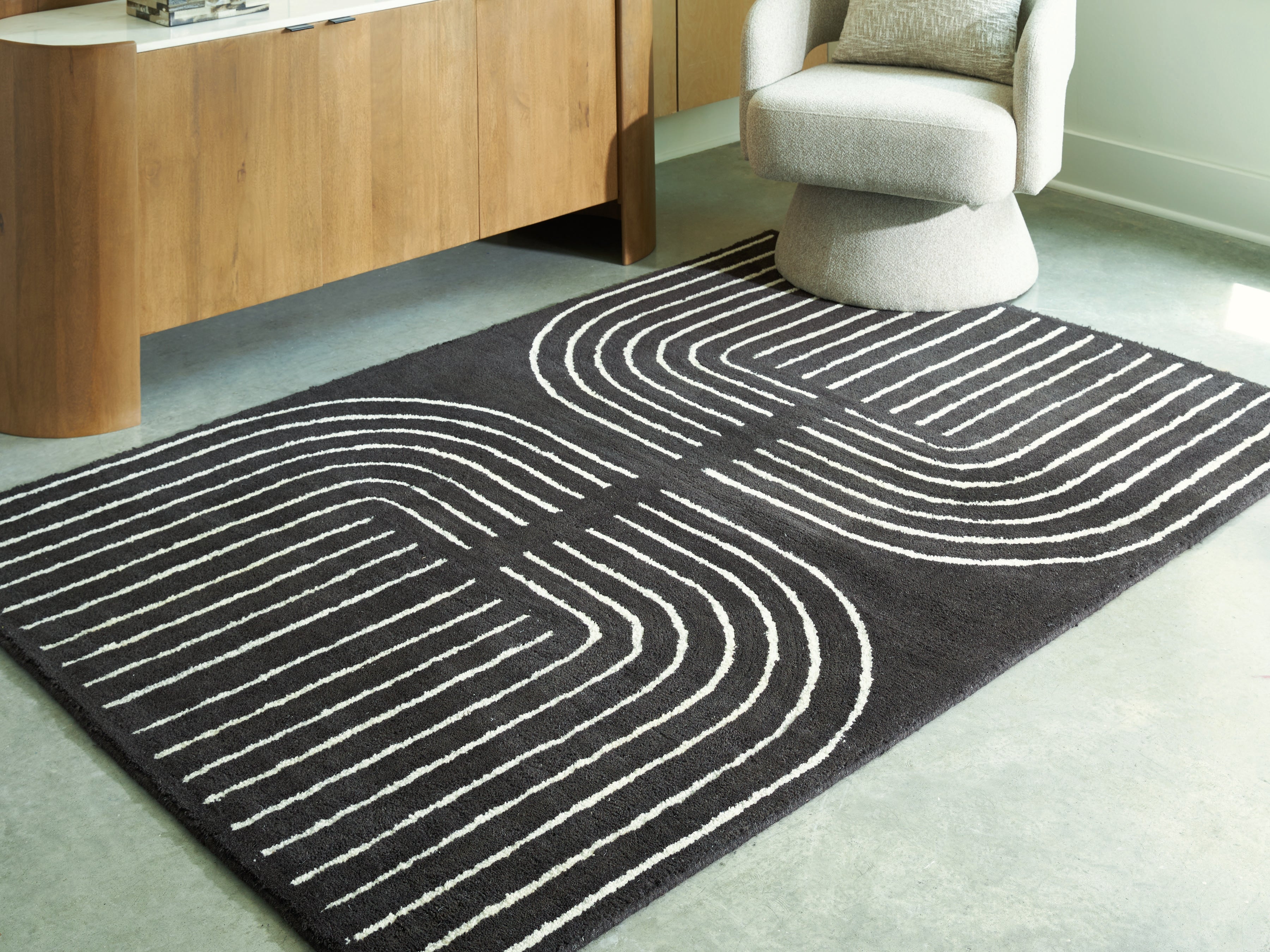 Coral Furniture - Ashley Furniture - Eldonmore Rug - 5' x 7' Area Rug / Black/Ivory - R407572