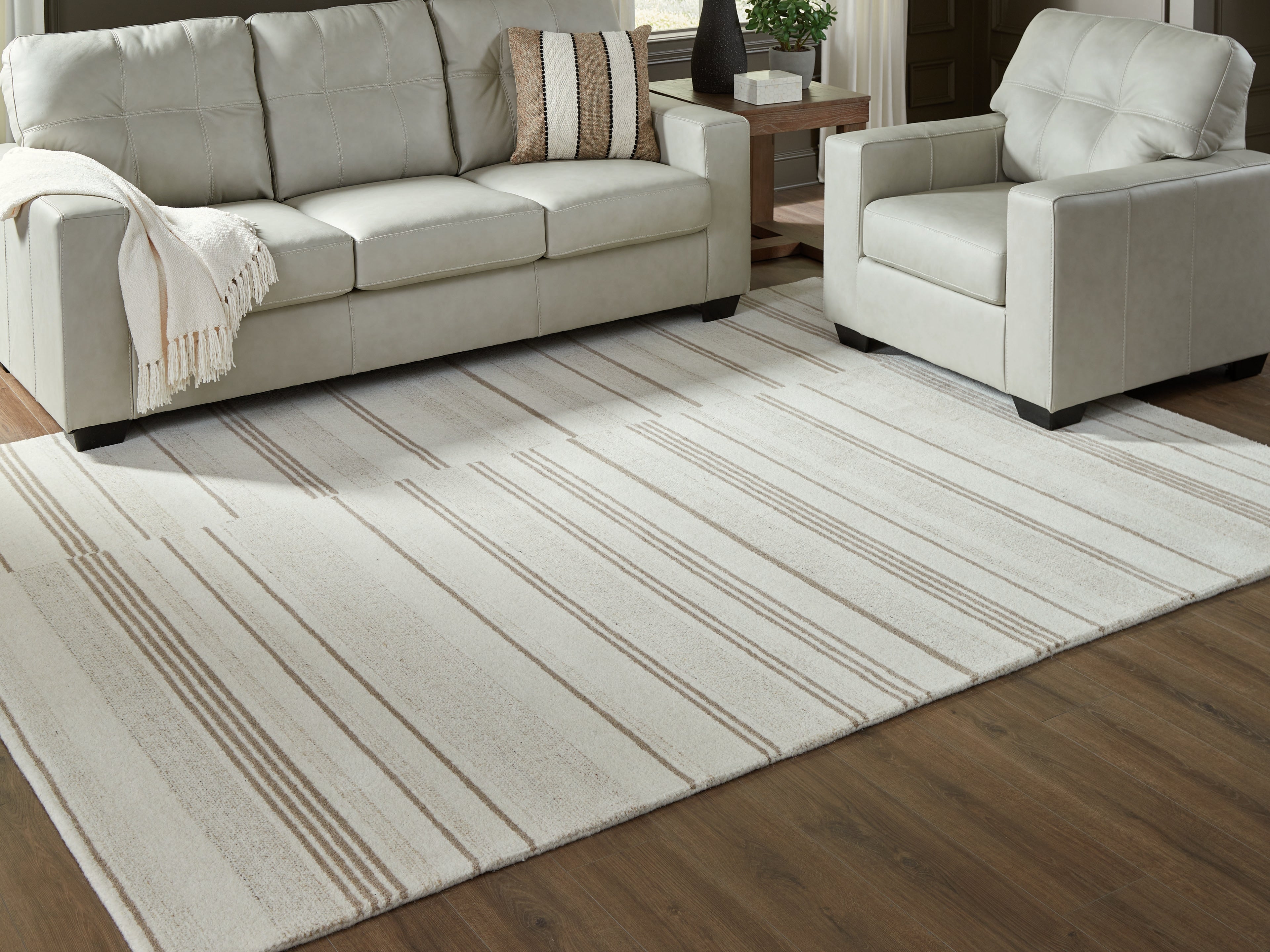 Coral Furniture - Ashley Furniture - Gadence Rug - 5' x 7' Area Rug / Ivory/Tan - R407642