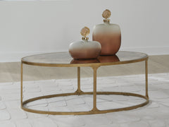 Coral Furniture - Ashley Furniture - Korajane Coffee Table - Oval Cocktail Table / Antique Gold - T399-0