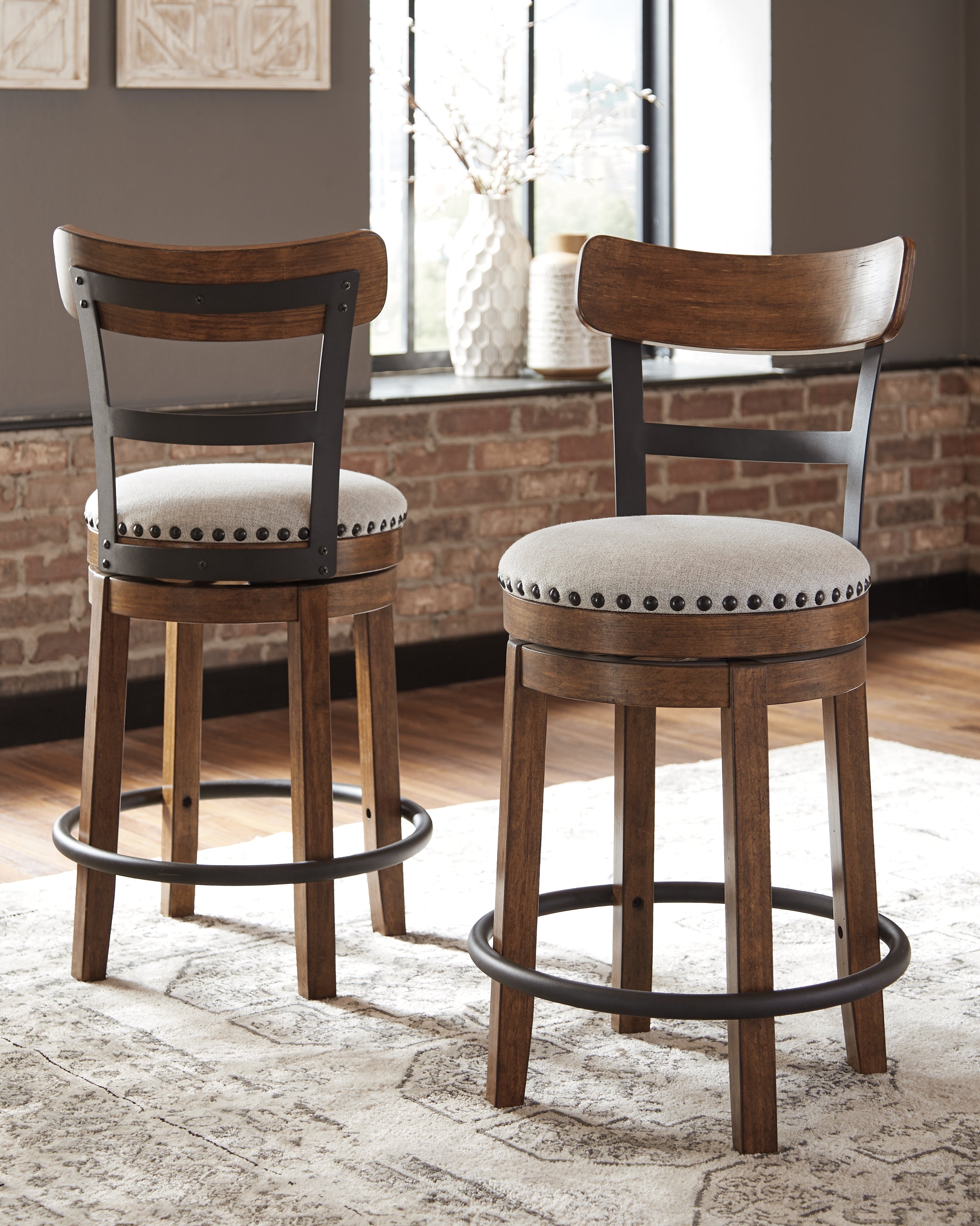 Coral Furniture - Ashley Furniture - Valebeck Dining Room - UPH Swivel Barstool (1/CN) / Brown - D546-424