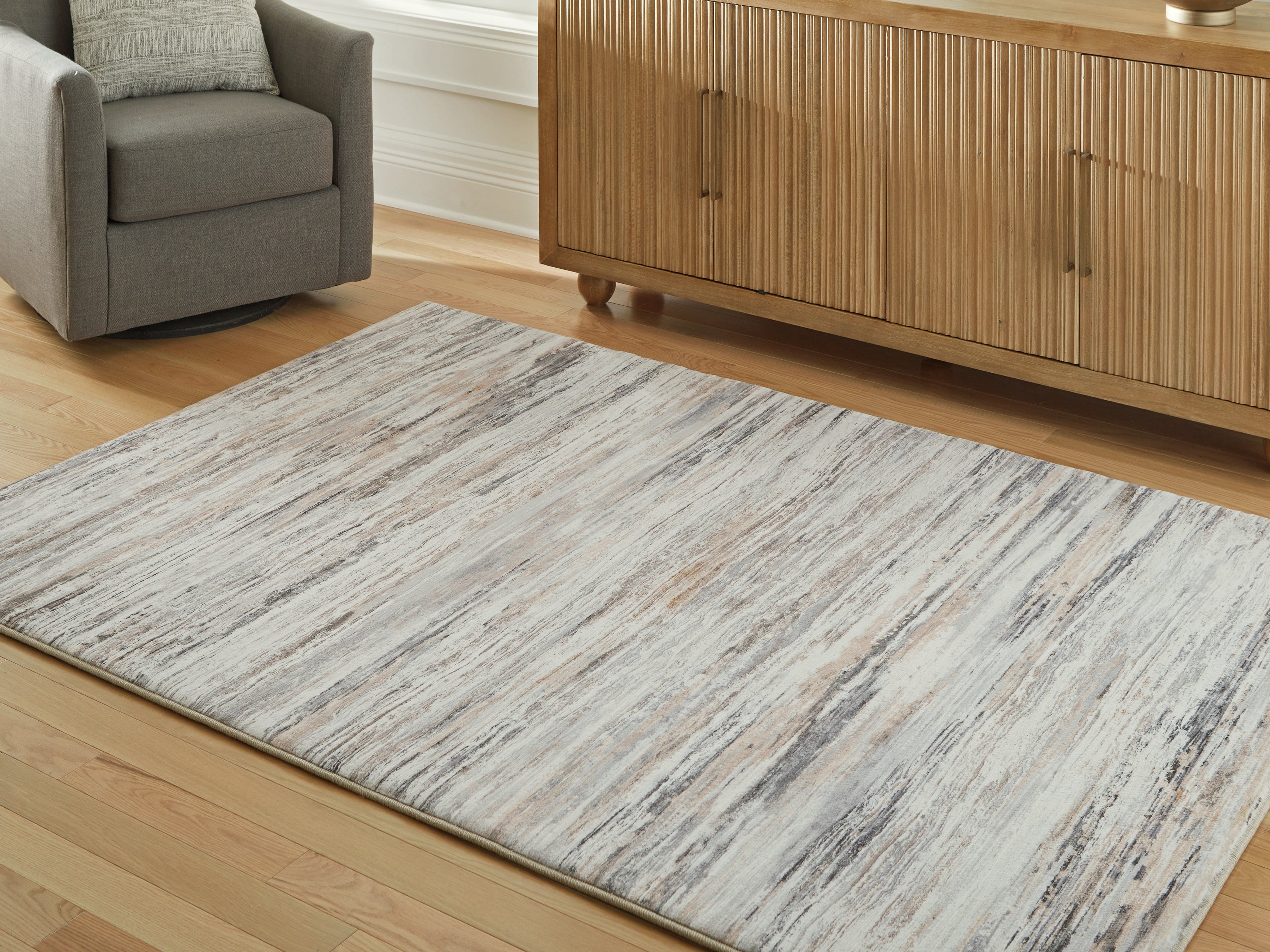 Coral Furniture - Ashley Furniture - Nace Rug - 5' x 7' Area Rug / Gray/Brown/White - R407472