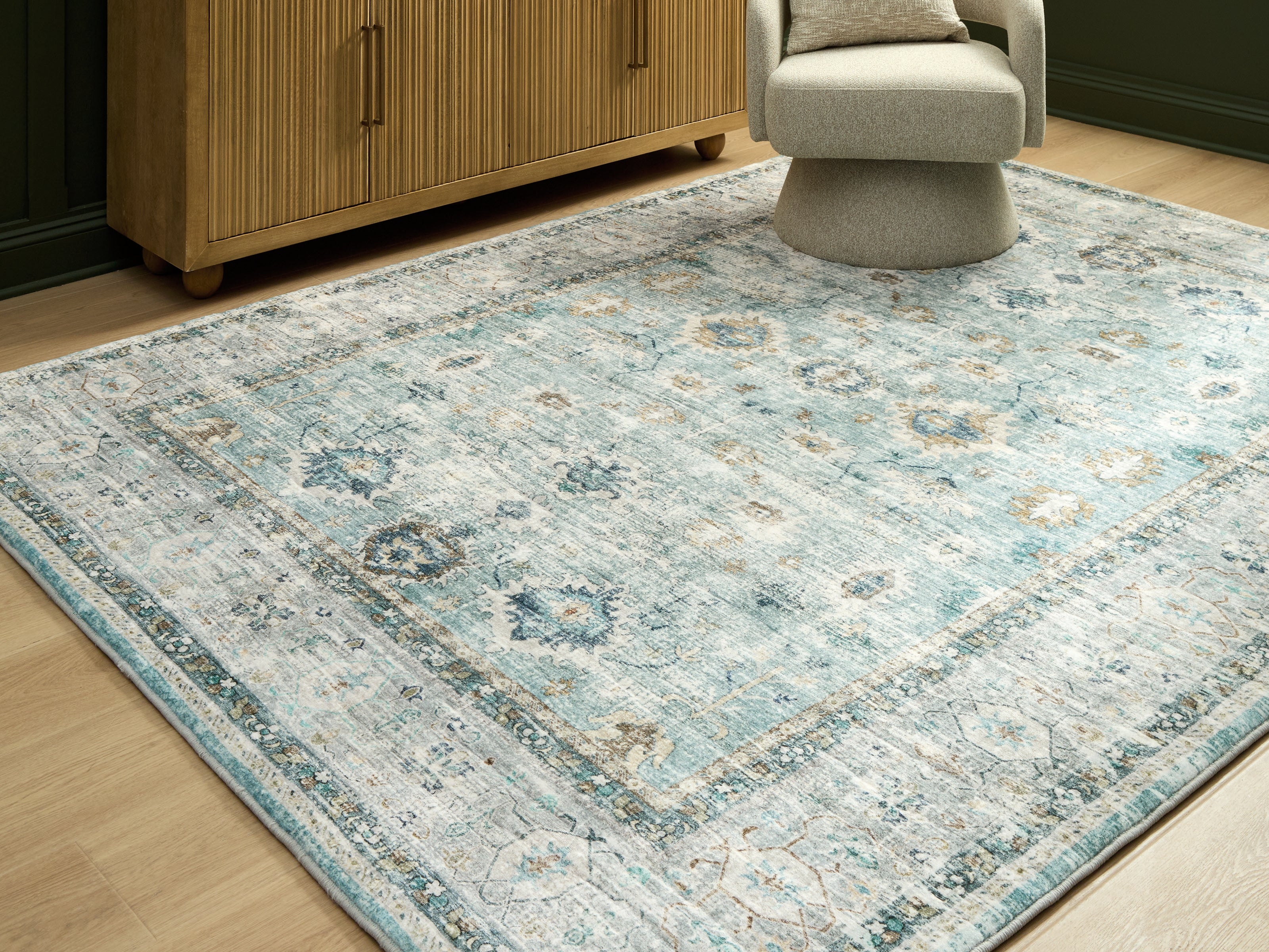 Coral Furniture - Ashley Furniture - Ladstoney Rug - 7'6" x 9'6" Area Rug / Teal/Beige/Ochre - R407501