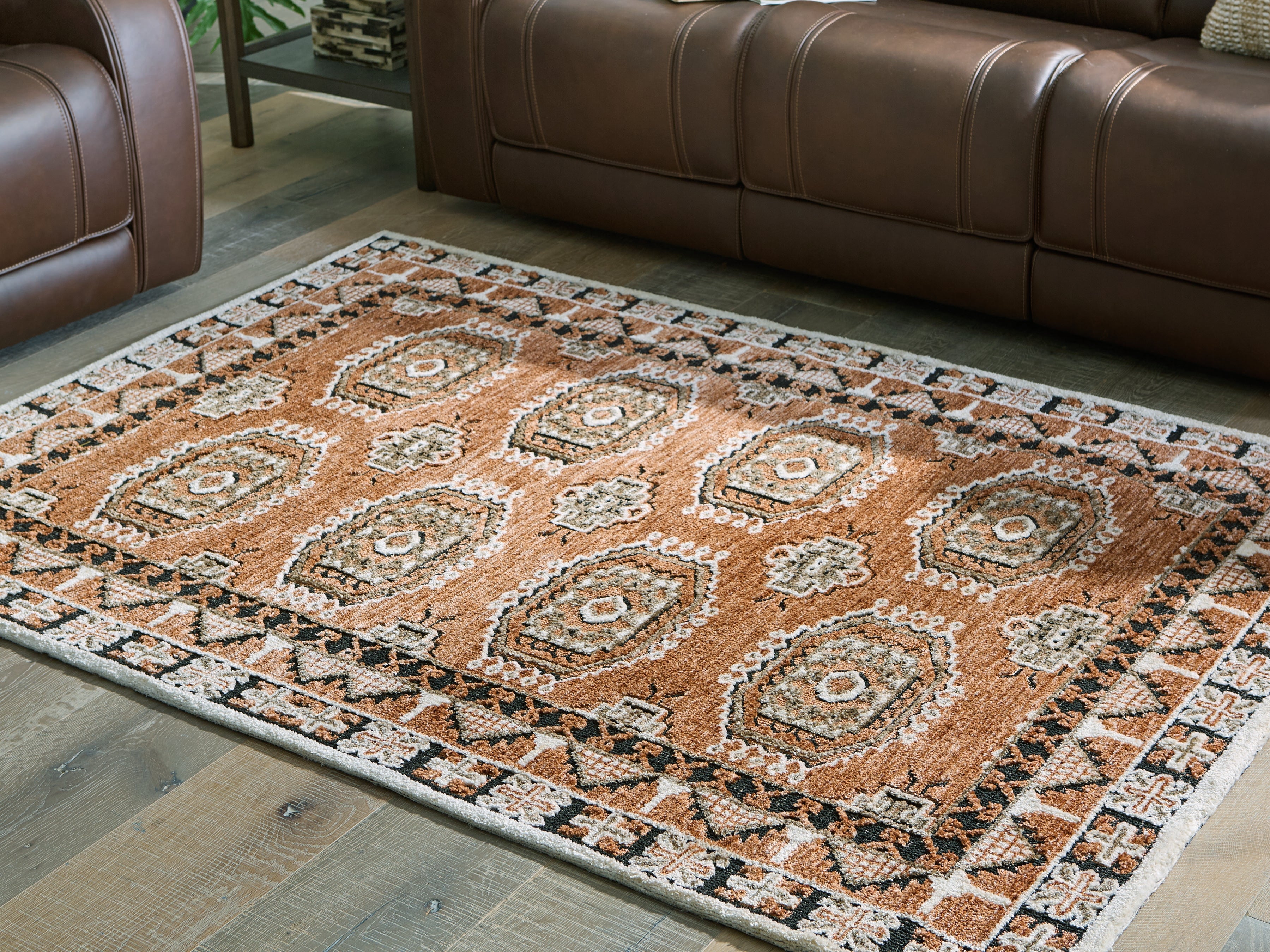 Coral Furniture - Ashley Furniture - Qaabiz Rug - 5' x 7' Area Rug / Sienna/Ivory/Black - R407522