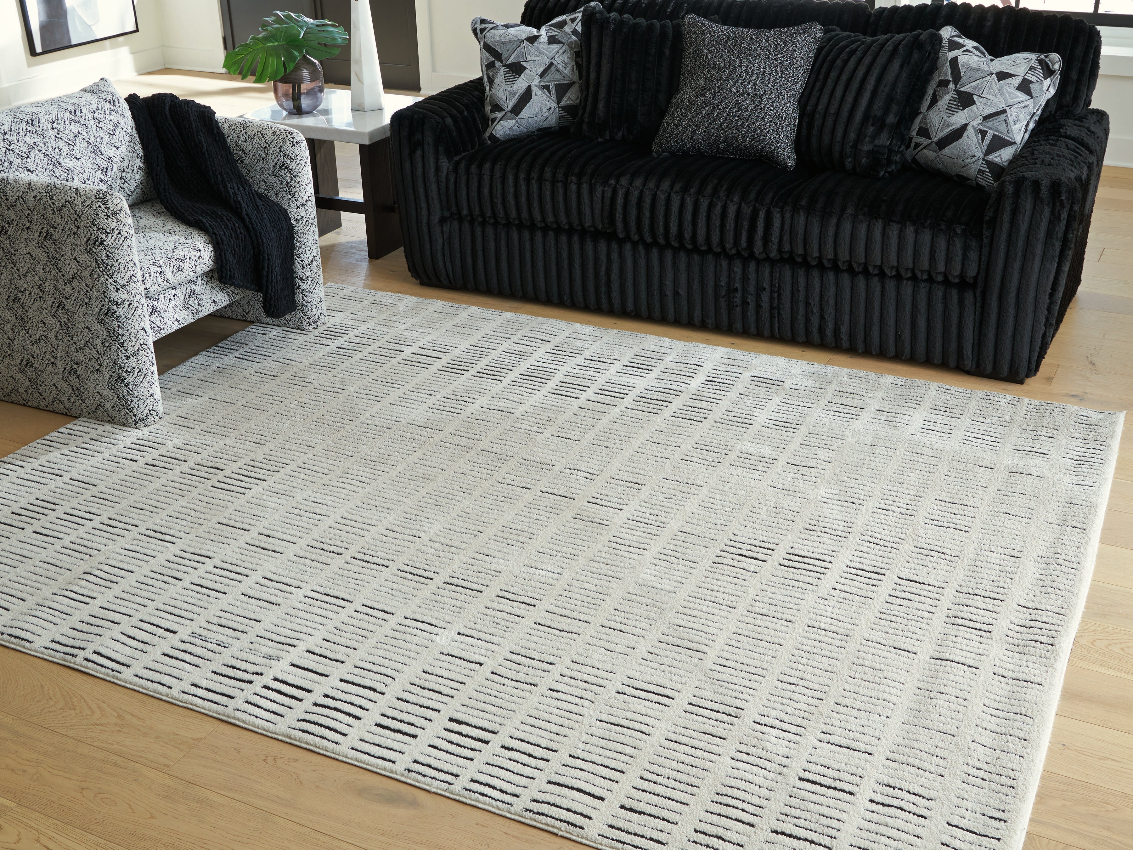 Coral Furniture - Ashley Furniture - Turinwith Rug - 7'10" x 9'10" Area Rug / Ivory/Black - R407551