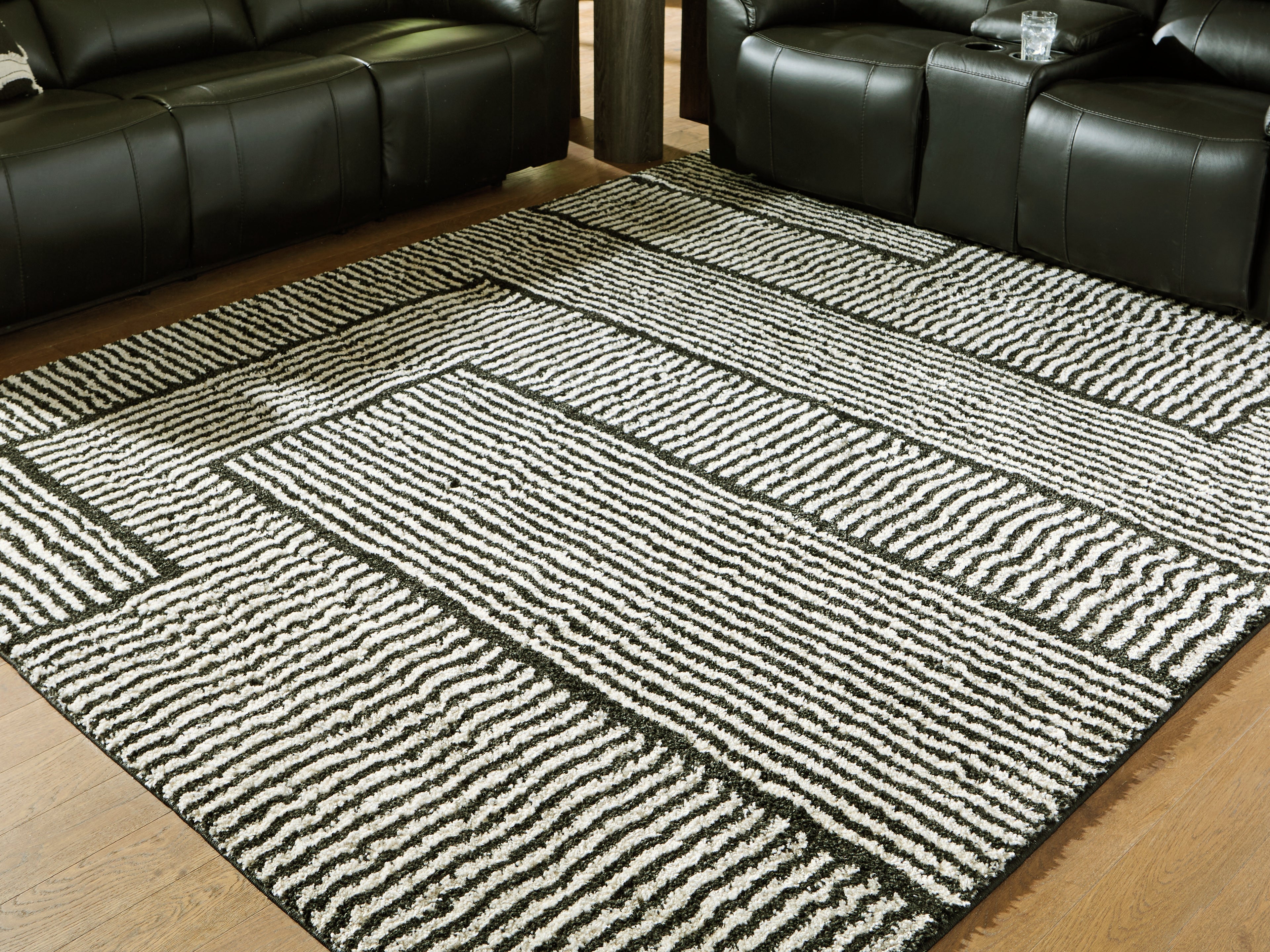 Coral Furniture - Ashley Furniture - Kurtmen Rug - 7'10" x 9'10" Area Rug / Black/Ivory - R407591