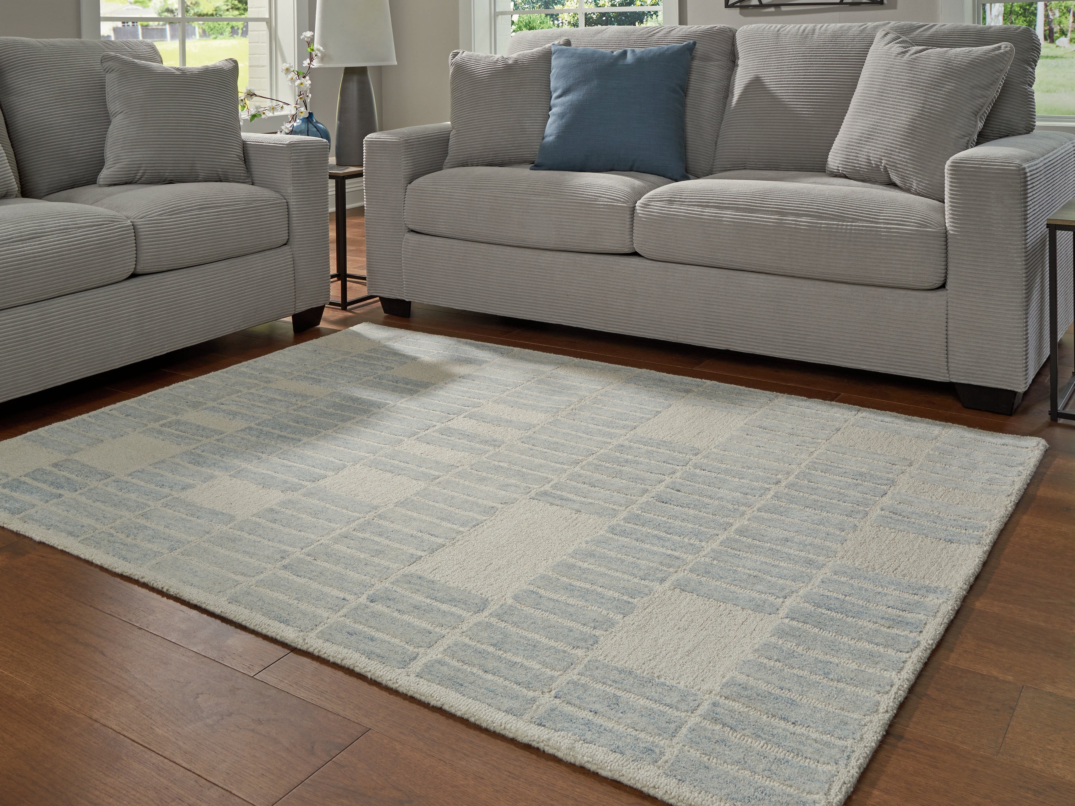 Coral Furniture - Ashley Furniture - Dylanton Rug - 5' x 7' Area Rug / Ivory/Blue - R407812