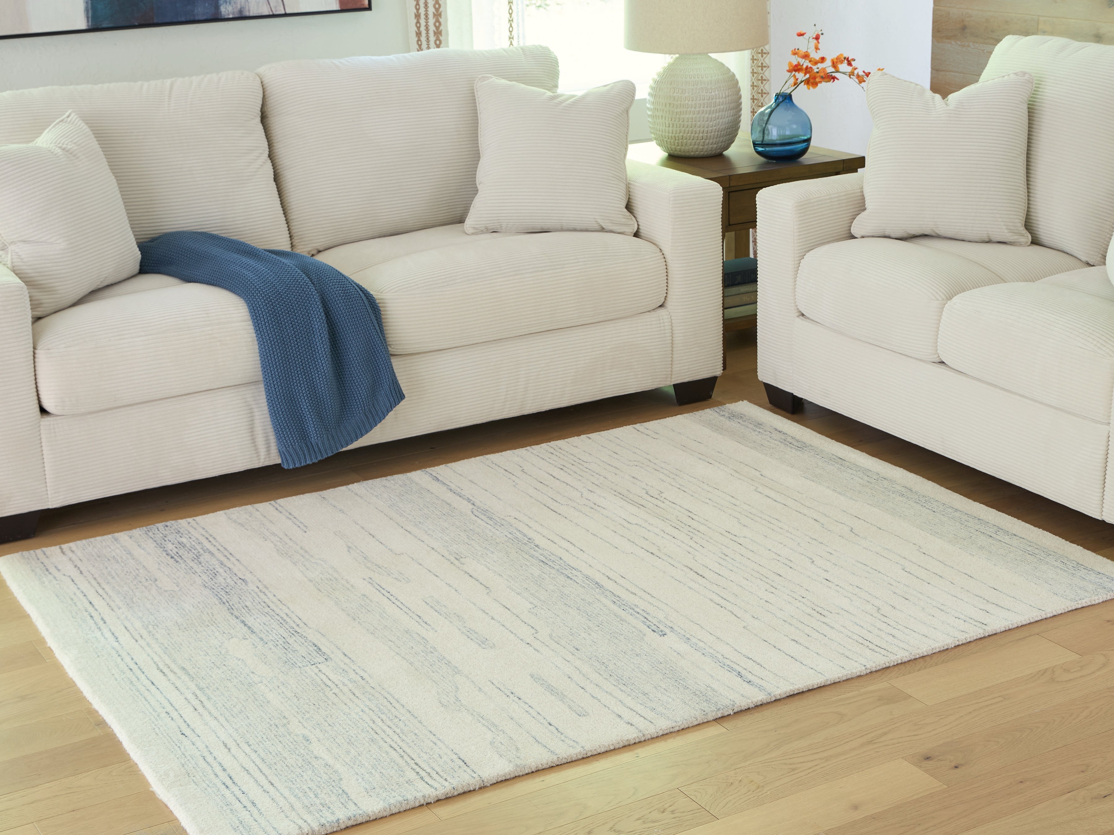 Coral Furniture - Ashley Furniture - Genemost Rug - 5' x 7' Area Rug / Ivory/Blue - R407842