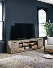 Coral Furniture - Ashley Furniture - Krystanza 92" TV Stand - 92" / Weathered Gray - W760-78